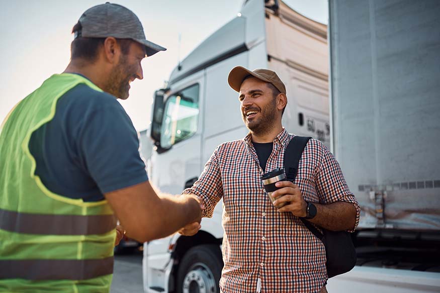 Driving dispatch boss shaking hands with cdl driver
