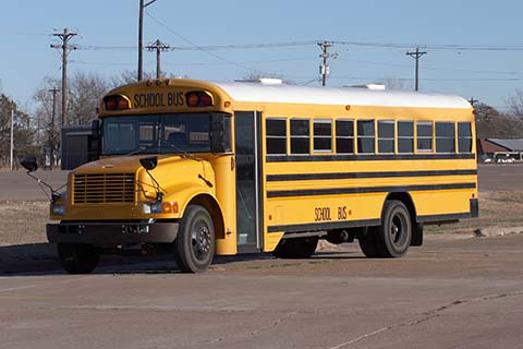 School bus that can be driven by a CDL licensee with their DOT exam wallet card.
